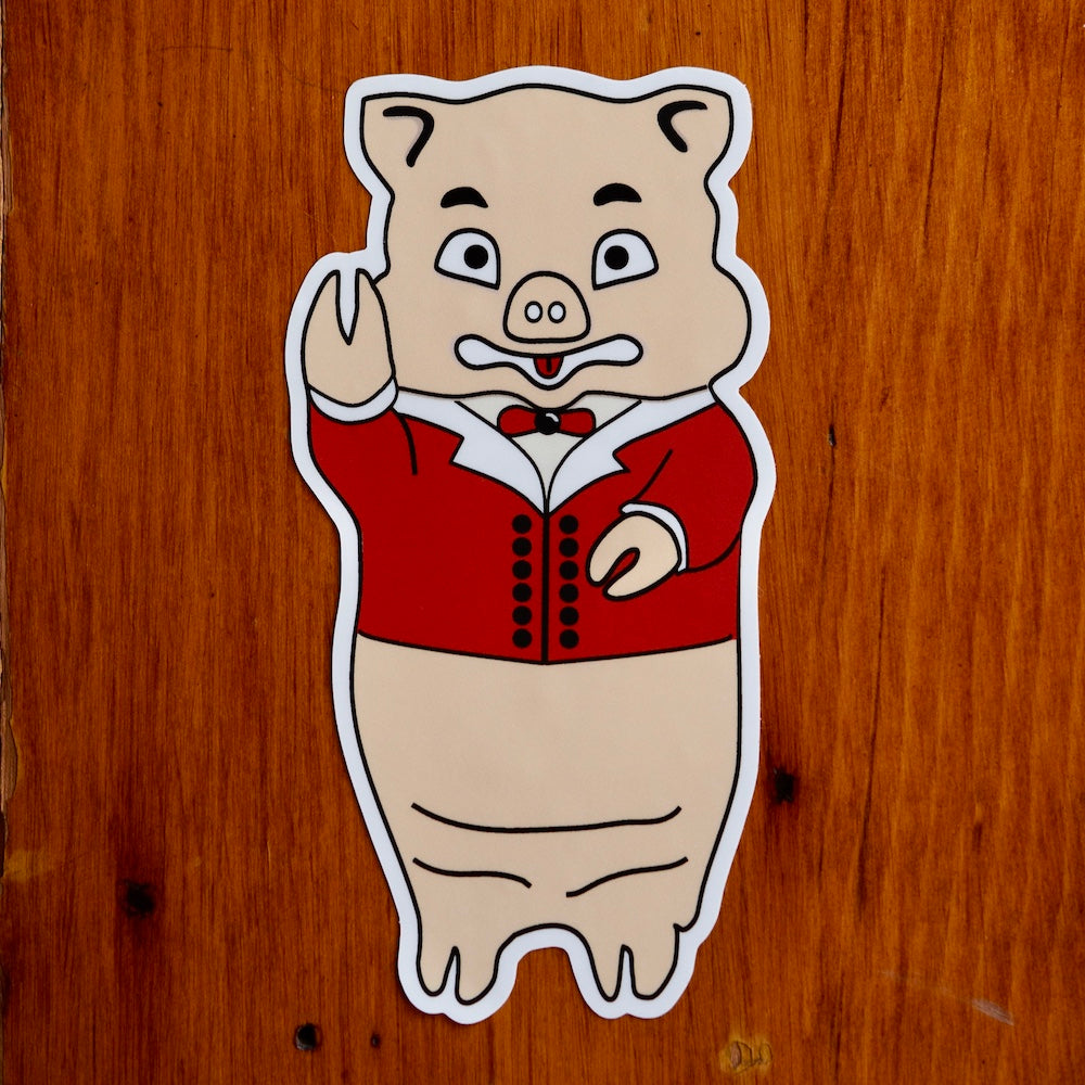 Vintage Baron Von Swine pig sticker from Rudy’s Bar & Grill on wood background, classic NYC bar souvenir